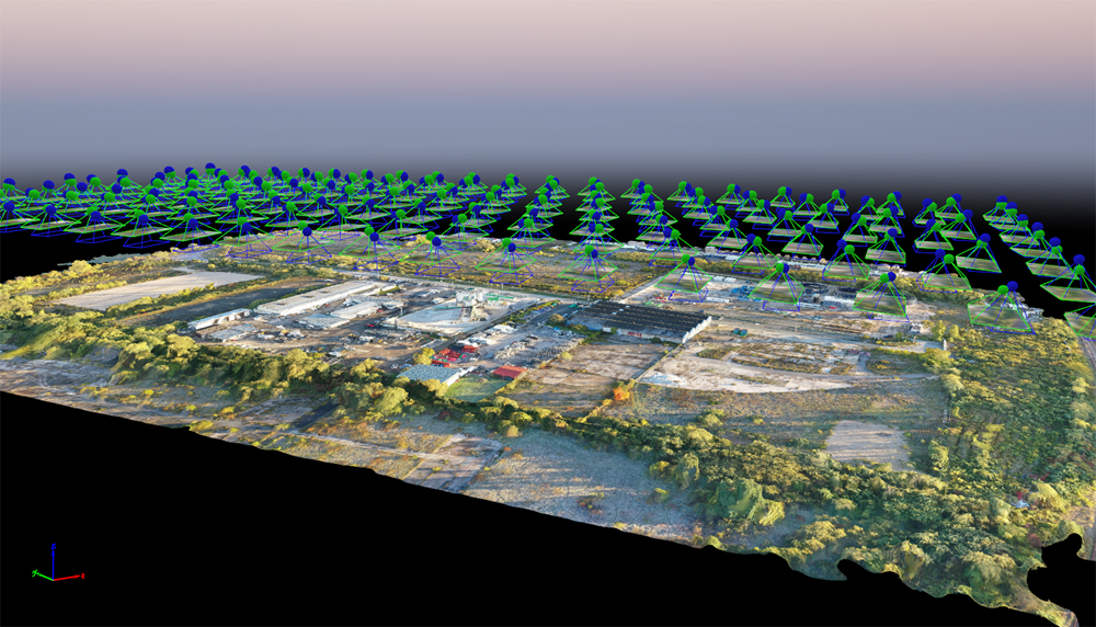 Modélisation 3D d’un site industriel ou de chantier à partir de prises de vue aériennes, illustrée par des repères de positionnement de caméra